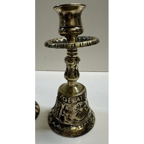 308 - A pair of brass tavern bell candlesticks