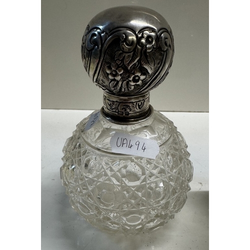 320 - A silver topped 1904 scent bottle & 1 other