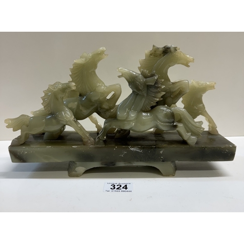 324 - A large polished green stone rampaging horse group