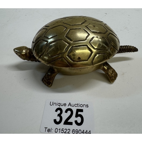 325 - A vintage brass novelty turtle counter top clockwork bell