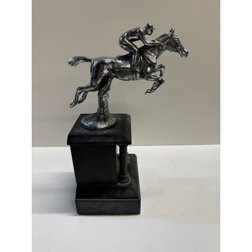 330 - A car mascot of a race horse mounted on a black marble base