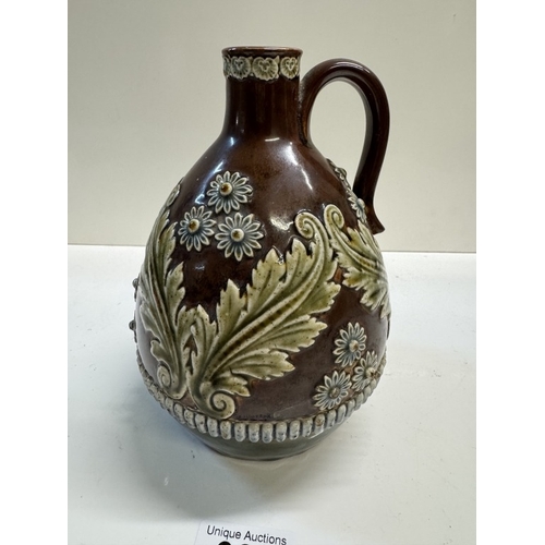 334 - A 19th century Lambeth whiskey bottle with raised floral decoration