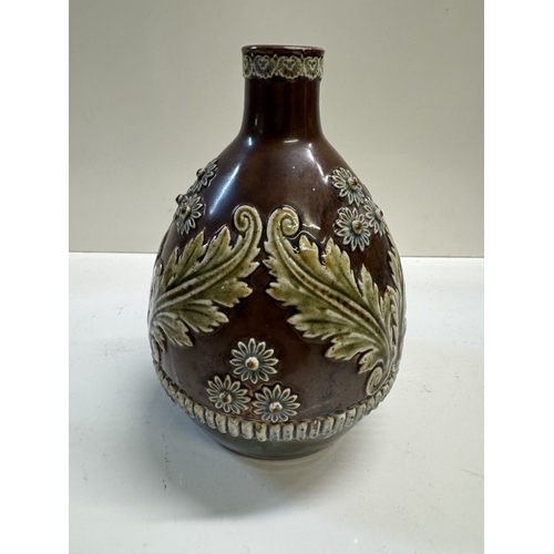 334 - A 19th century Lambeth whiskey bottle with raised floral decoration