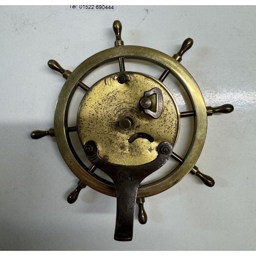 338 - A 1930's brass ships wheel clock