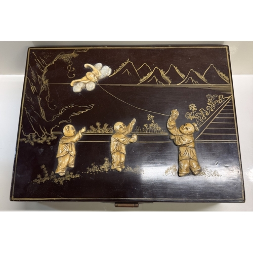 339 - An oriental lacquered jewellery box. 33.5cm x 25.5cm x 11cm