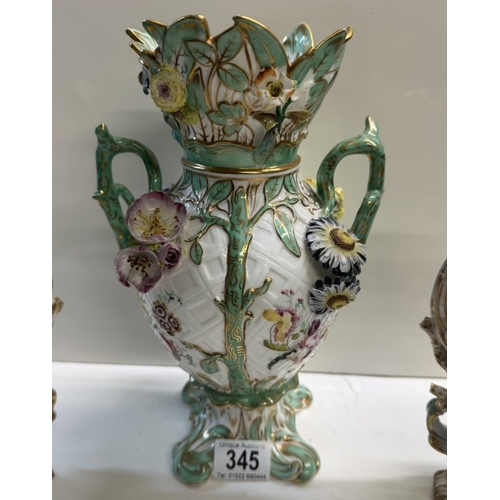 345 - A pair of continental ceramic vases with floral decoration & another continental floral decorated va... 