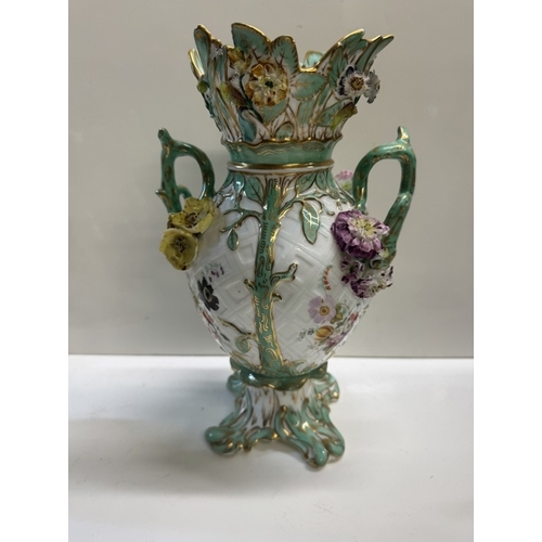 345 - A pair of continental ceramic vases with floral decoration & another continental floral decorated va... 