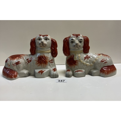 347 - A pair of Staffordshire style ceramic dogs in the lying down position