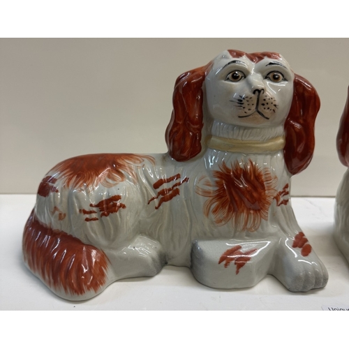 347 - A pair of Staffordshire style ceramic dogs in the lying down position