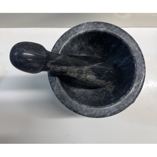 358 - A polished stone pestle & mortar