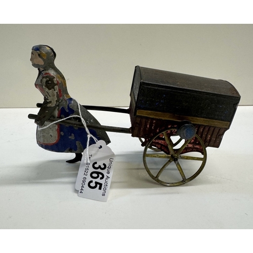 365 - A Charles Rossignol circa 1880 flywheel tinplate lady pulling a cart (missing 1 arm & has a glued re... 