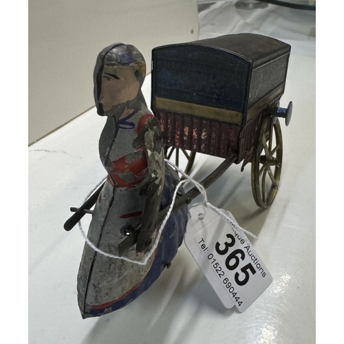 365 - A Charles Rossignol circa 1880 flywheel tinplate lady pulling a cart (missing 1 arm & has a glued re... 