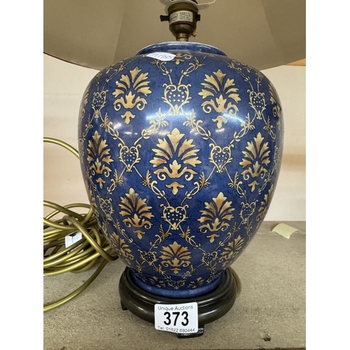 373 - A Decorative ginger jar shaped lamp with shade