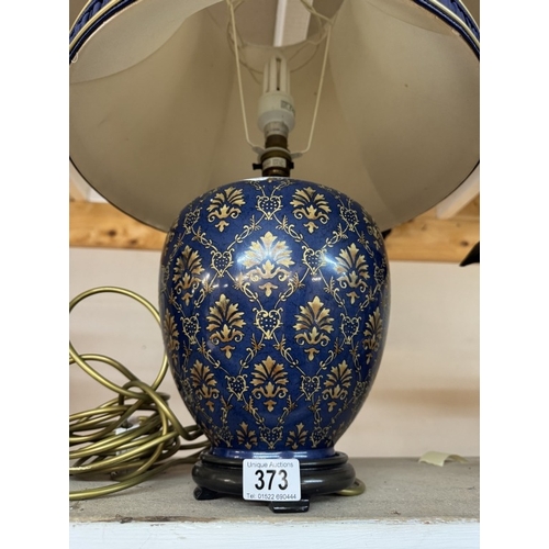 373 - A Decorative ginger jar shaped lamp with shade