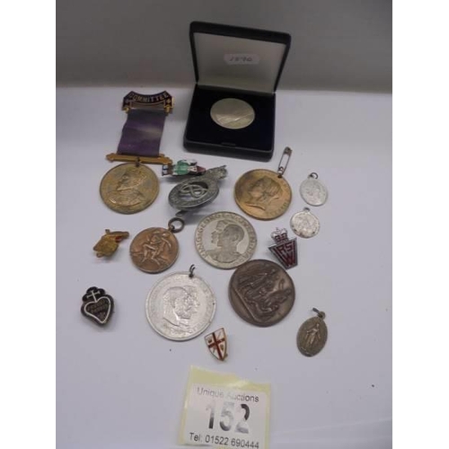 152 - A mixed lot of medals, coins, badges etc.,