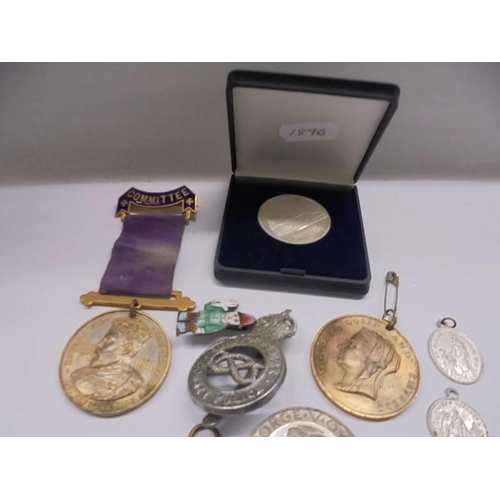 152 - A mixed lot of medals, coins, badges etc.,