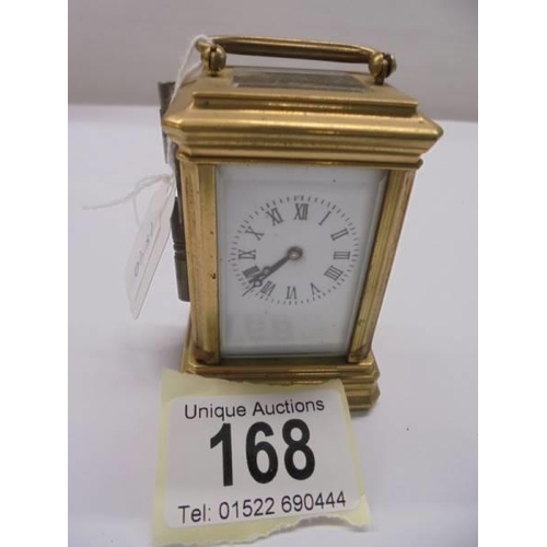 168 - A miniature brass carriage clock.