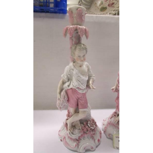 179 - A pair of 19th century continental porcelain figures.