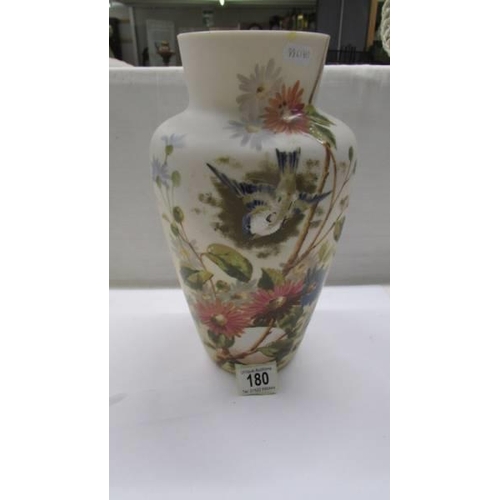 180 - A 19th century glass vase hand painted with birds and flowers.