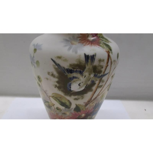 180 - A 19th century glass vase hand painted with birds and flowers.