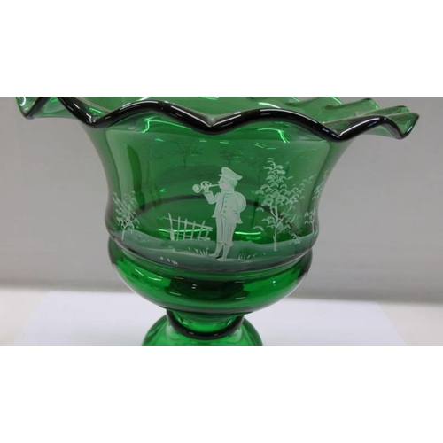 183 - A green glass footed bowl hand painted in the style of Mary Gregory.