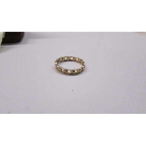 100A - A 9ct gold ring in the Celtic style in an open design, size O, 1.64 grams.