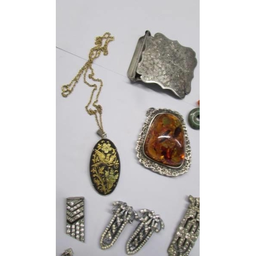 100F - A mixed lot of jewellery including art deco paste, amber pendant, earrings and other items etc.,