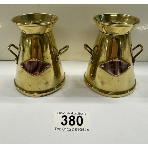 380 - A pair of vintage brass milk churn match strikers