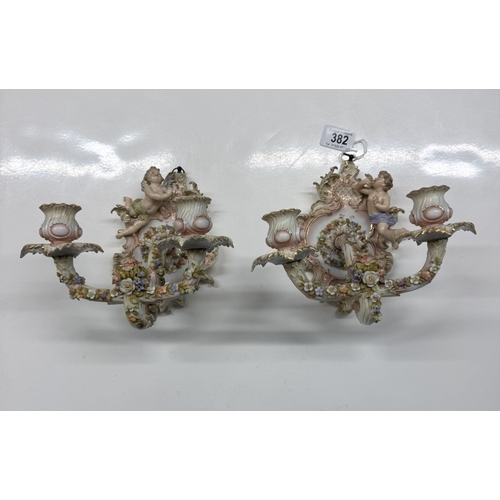 382 - A pair of continental porcelain wall candle sticks