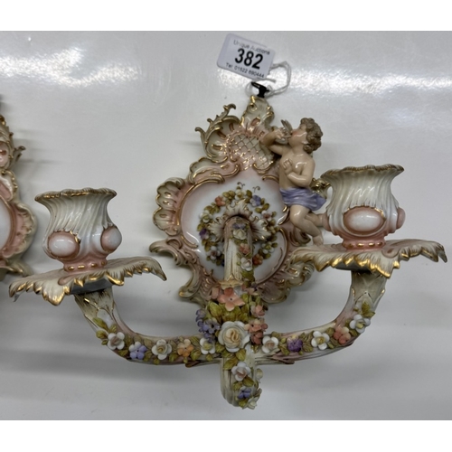 382 - A pair of continental porcelain wall candle sticks