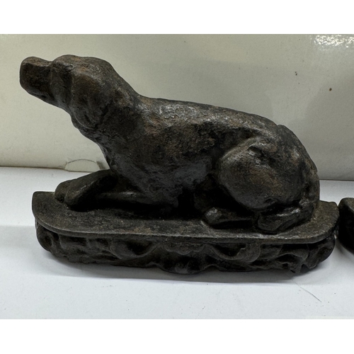 391 - A pair of Victorian metal dogs. Left / right