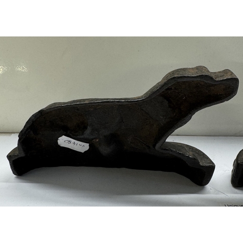 391 - A pair of Victorian metal dogs. Left / right