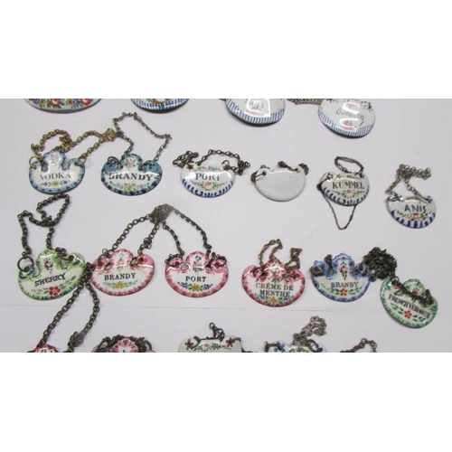 209 - Forty antique enamel decanter labels.