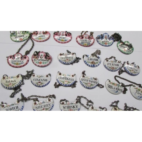 209 - Forty antique enamel decanter labels.