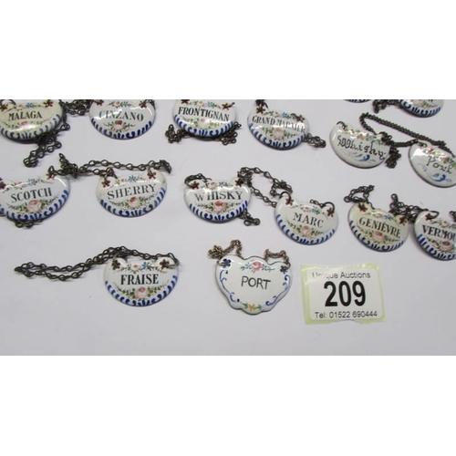 209 - Forty antique enamel decanter labels.