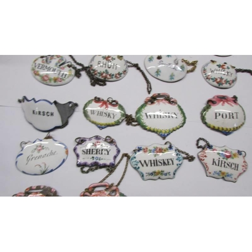 210 - Twenty enamel decanter labels.