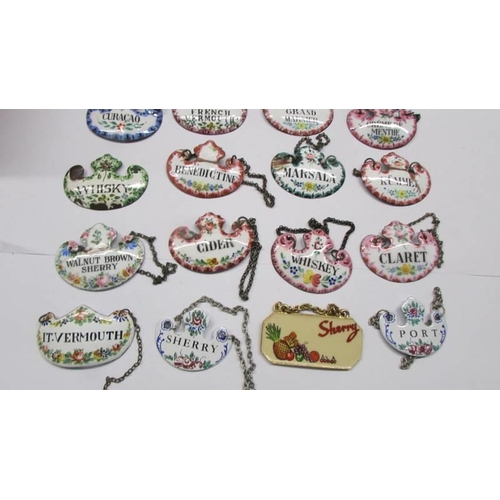 211 - Thirty old enamel decanter labels.