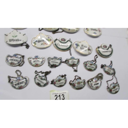 213 - Forty four ceramic decanter labels including sets.