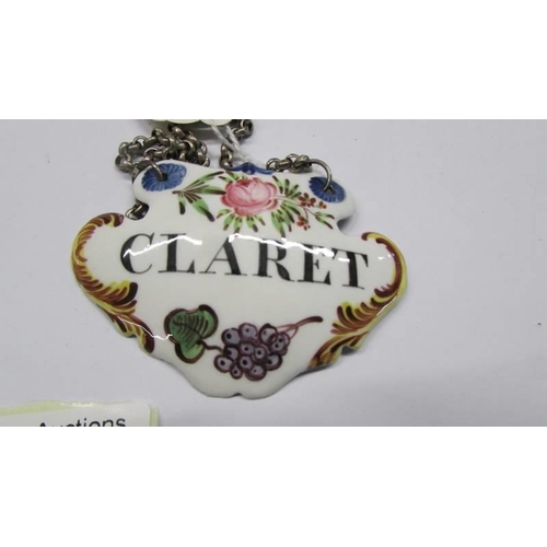 221 - Two circa 1800's Bilston enamel wine labels - 'Madeira (in original condition) and 'Claret (restored... 