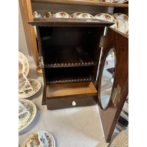 398 - An Edwardian oak smokers cabinet