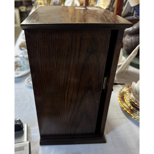 398 - An Edwardian oak smokers cabinet