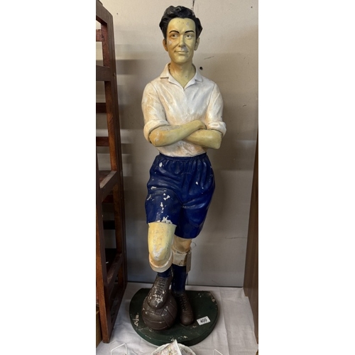 400 - A fibreglass figure of a vintage football player, height 93cm