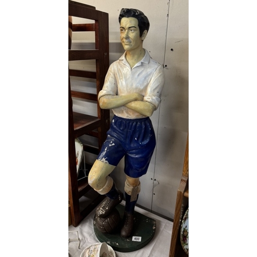 400 - A fibreglass figure of a vintage football player, height 93cm