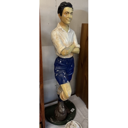 400 - A fibreglass figure of a vintage football player, height 93cm