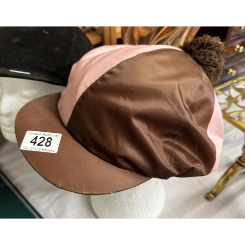 428 - A riding hat & jockey's riding hat cover