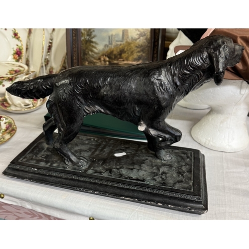 431 - A large plaster figure of a Gun dog with a bronzed finish