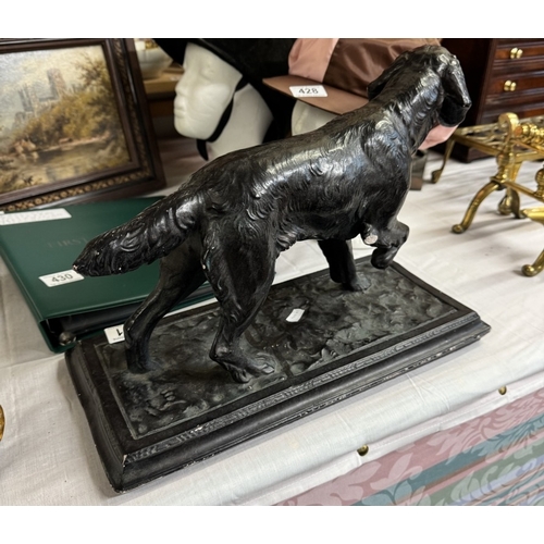 431 - A large plaster figure of a Gun dog with a bronzed finish