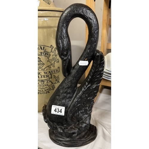 434 - A large cast iron swan door stop, height 39cm