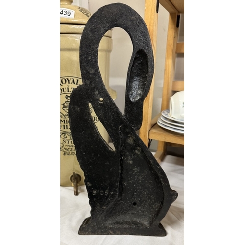 434 - A large cast iron swan door stop, height 39cm