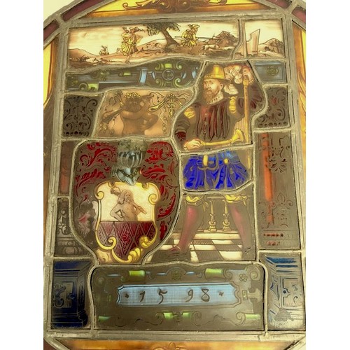 231 - A 16th century stained glass panel of Philip II of Spain, dated 1598, COLLECT ONLY.